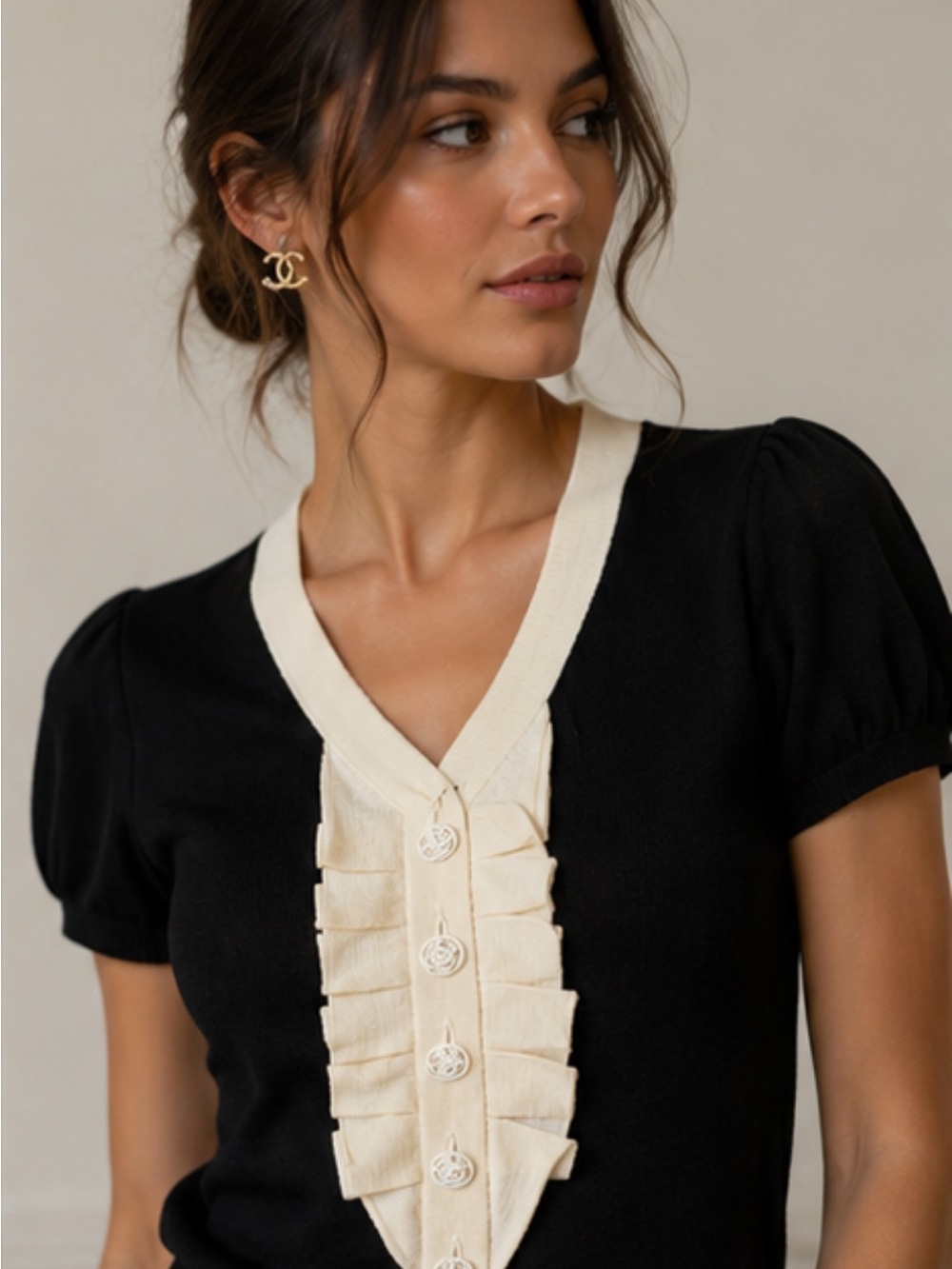 CHANEL 2007 Cashmere Black Knit Top with Cream Ruffle Bib and White Logo Buttons